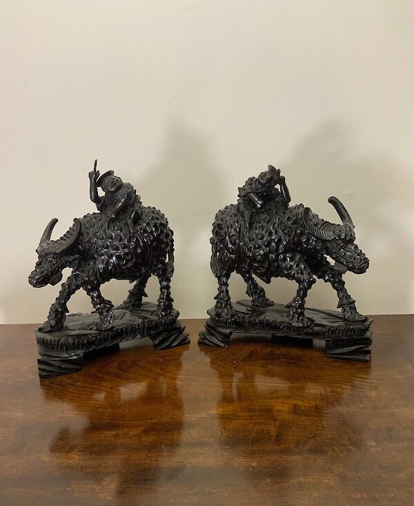 A large pair of Chinese hardwood carvings