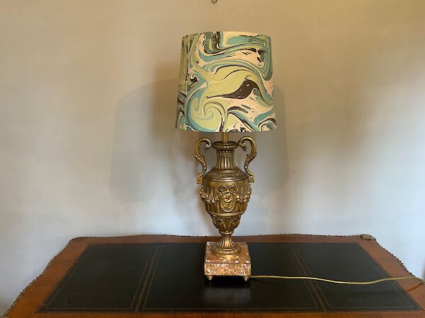 A gilt metal table lamp with handmade shade