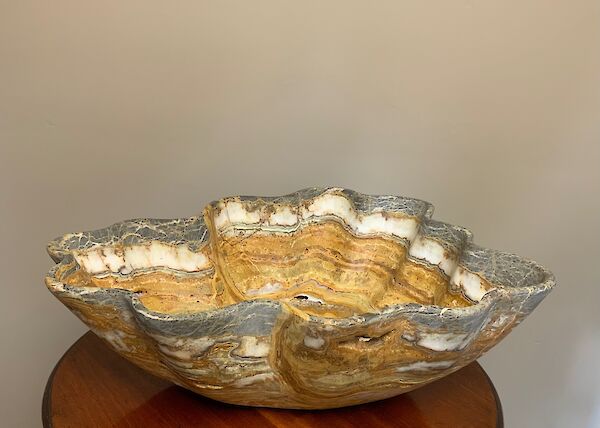 A large hand carved onyx bowl