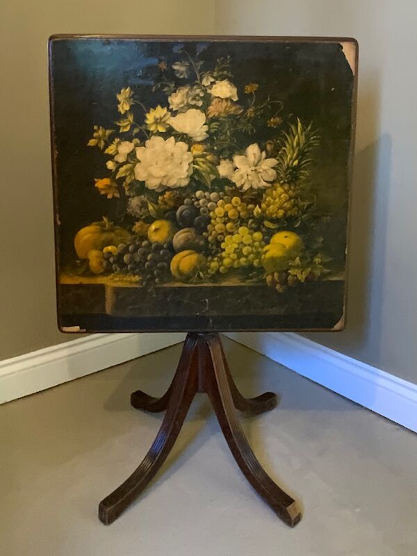A decorative mahogany based occasional table