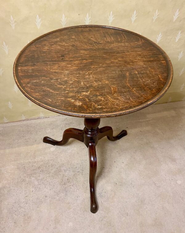 An oak tray top tripod table