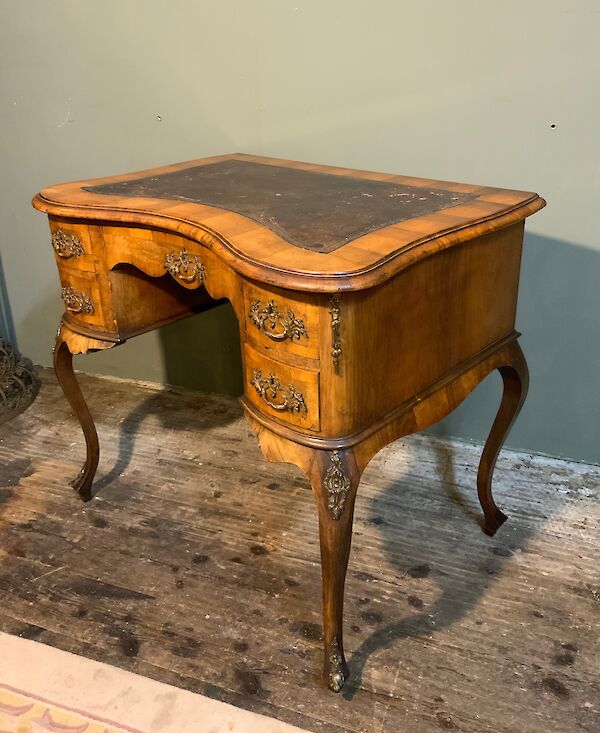 A French walnut writing table